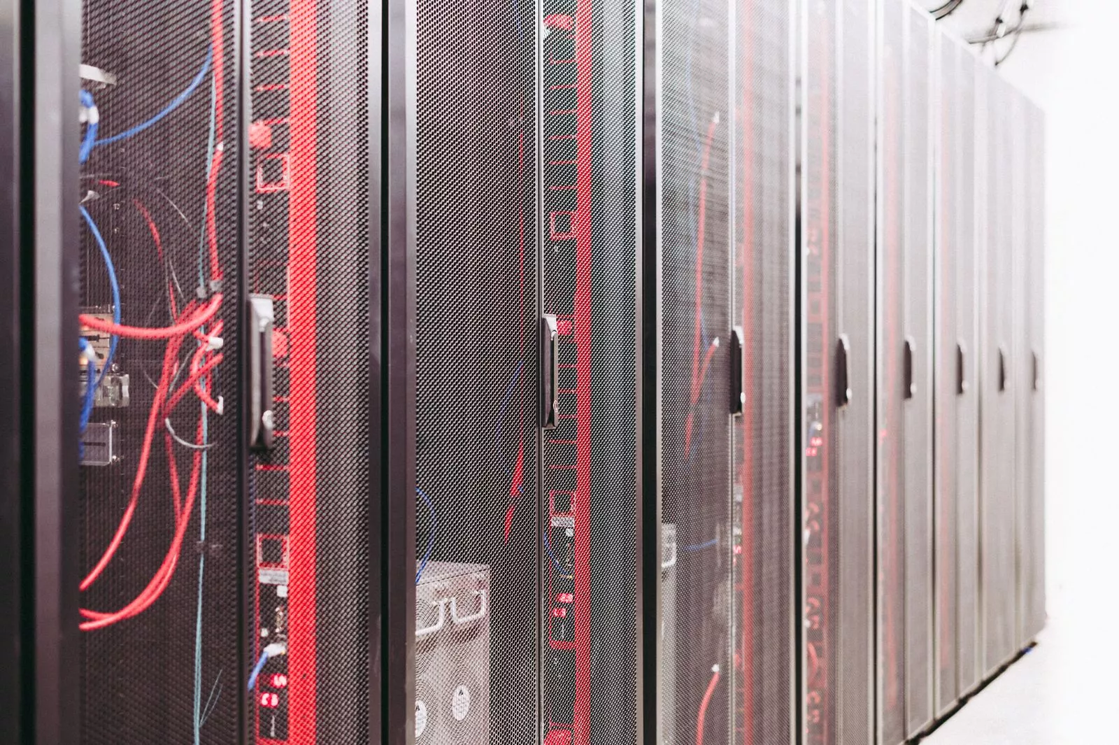 Rows of data center server racks illustrating the offsite, immutable backup infrastructure that protects small businesses from ransomware